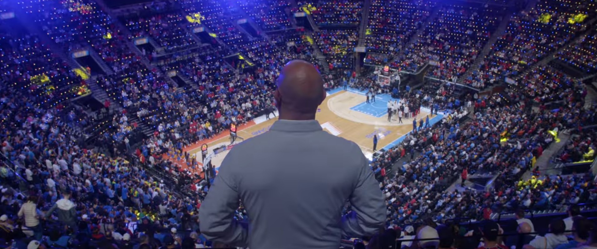 Rory overlooking the basketball court and crowd at Intuit Dome